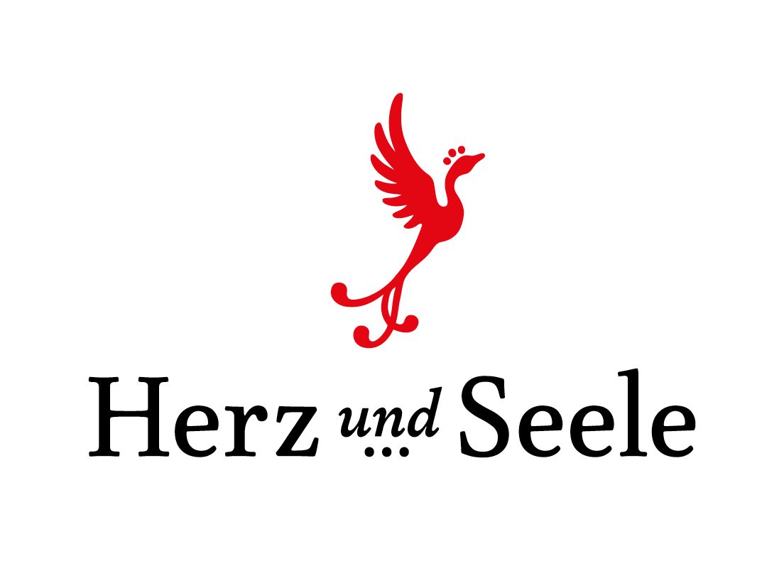 »Herz und Seele« Logo. Roter stilisierter Feuervogel über schwarzem Herz und Seele Schriftzug.
